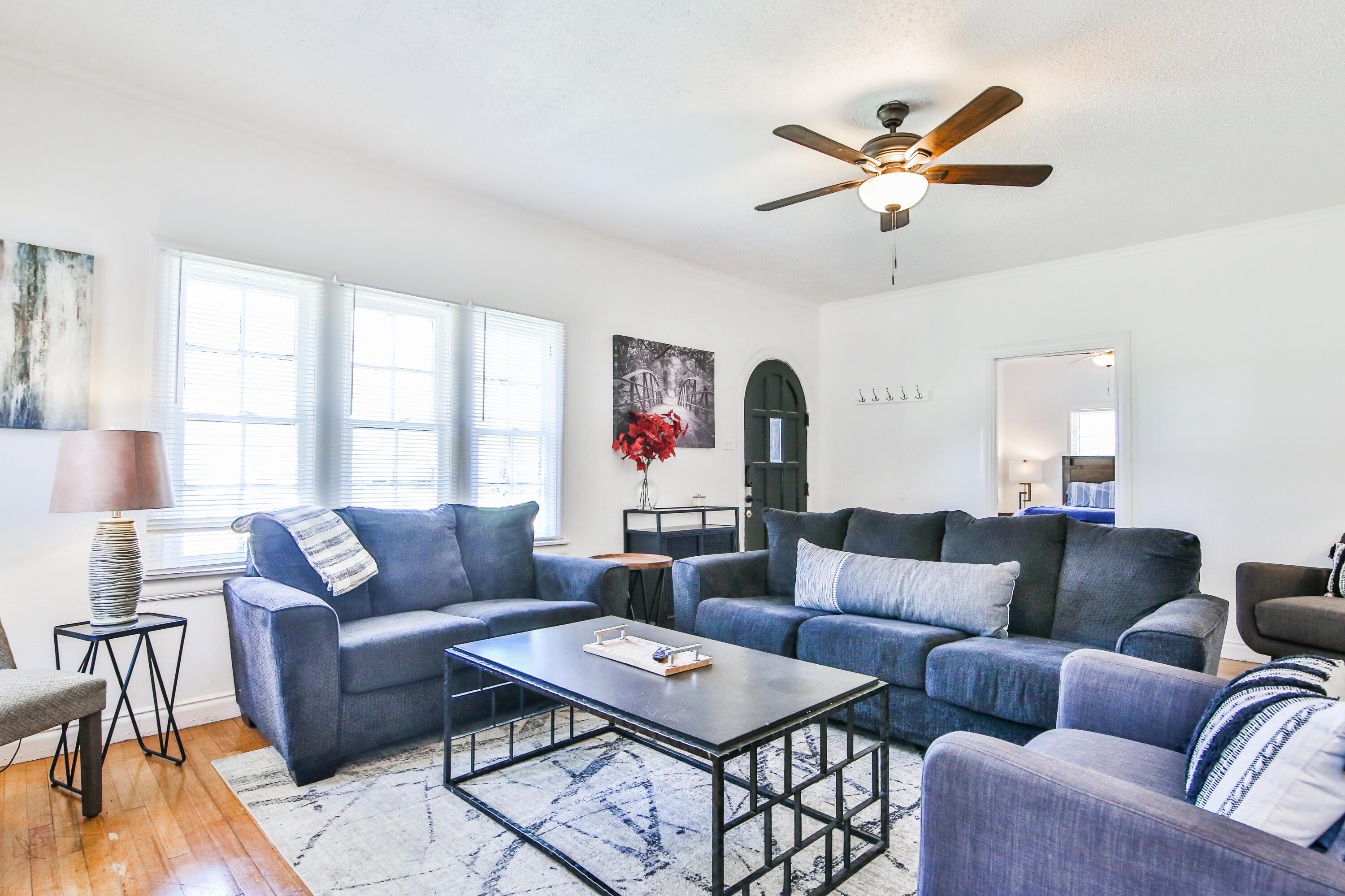 2309 17th Street Lubbock, TX 79401 - Photo 4 of 26 a living room with furniture and a large window