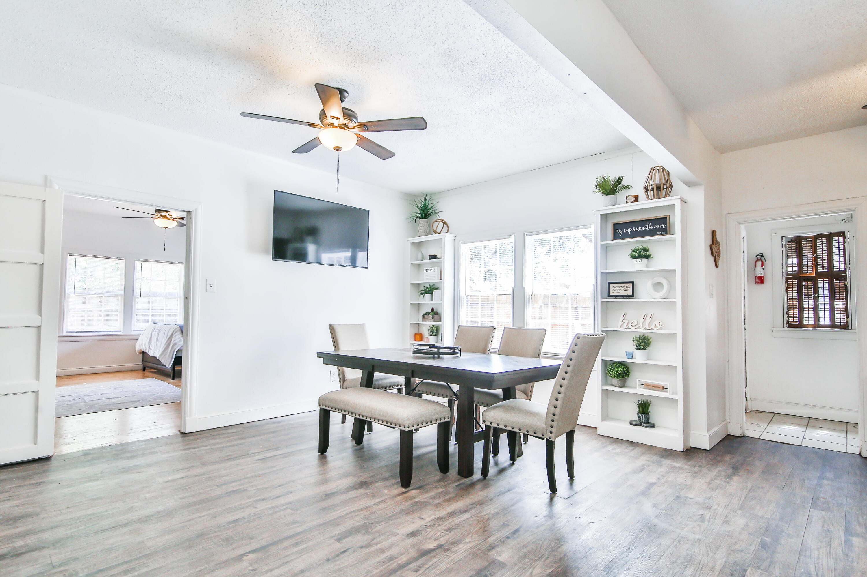 2309 17th Street Lubbock, TX 79401 - Photo 9 of 26 a view of a dining room with furniture window and wooden floor