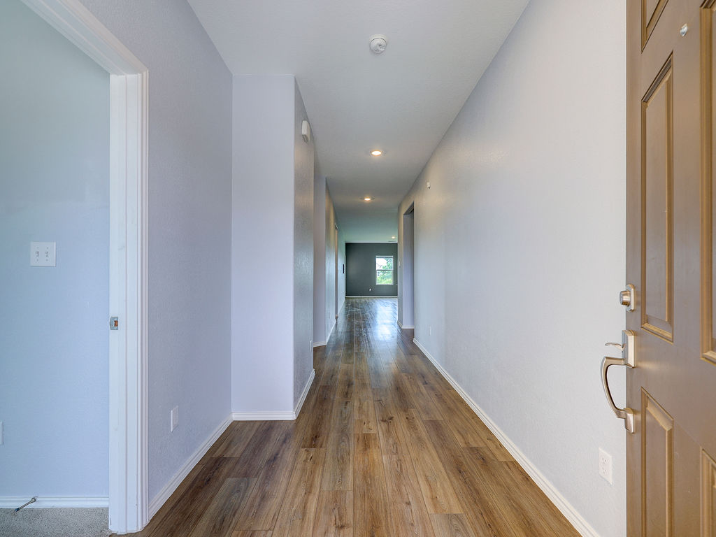 1716 Frontenac Street Leander, TX 78641 - Photo 3 of 34 a view of hallway with wooden floor