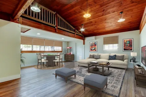 a living room with furniture or couch and a wooden floor