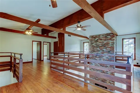 a view of an entryway with wooden floor and windows