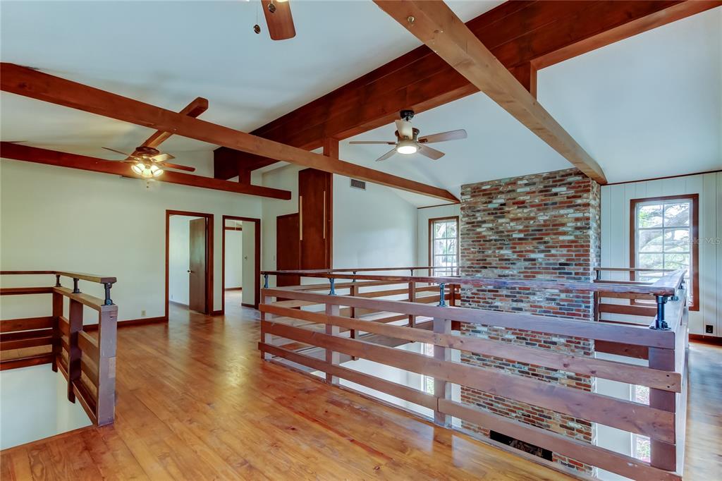 2901 Pelham Road North St. Petersburg, FL 33710 - Photo 21 of 32 a view of an entryway with wooden floor and windows