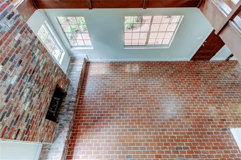 a view of an empty room with windows