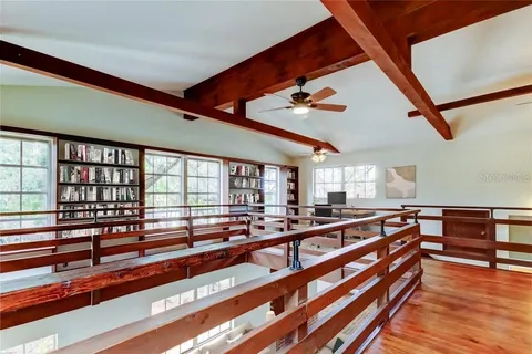 a open kitchen with stainless steel appliances granite countertop a sink and cabinets with wooden floor