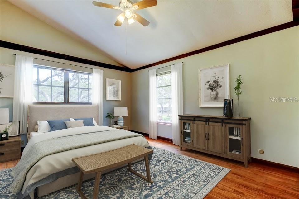 2901 Pelham Road North St. Petersburg, FL 33710 - Photo 26 of 32 a bedroom with a bed and a chandelier