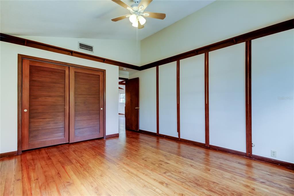 2901 Pelham Road North St. Petersburg, FL 33710 - Photo 27 of 32 a view of an empty room with wooden floor