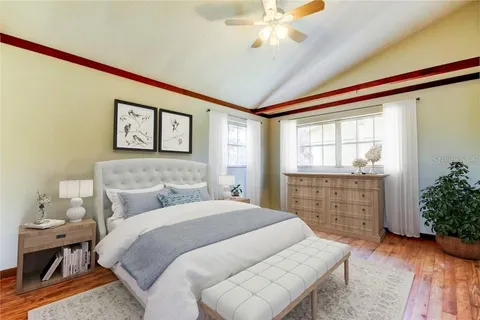 a bedroom with a bed and a dresser