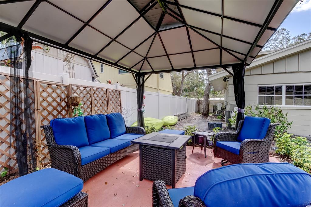 2901 Pelham Road North St. Petersburg, FL 33710 - Photo 31 of 32 a outdoor space with patio the couches and a dining table with the view of kitchen