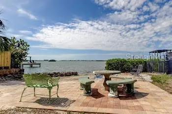 a view of a terrace with furniture and stove
