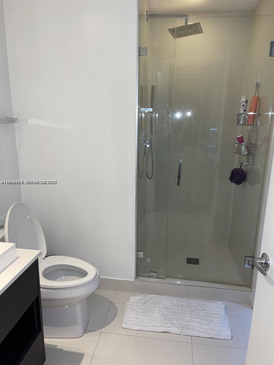 55 Southwest 9th Street, Unit 2307 Miami, FL 33130 - Photo 14 of 35 a bathroom with a toilet and a shower