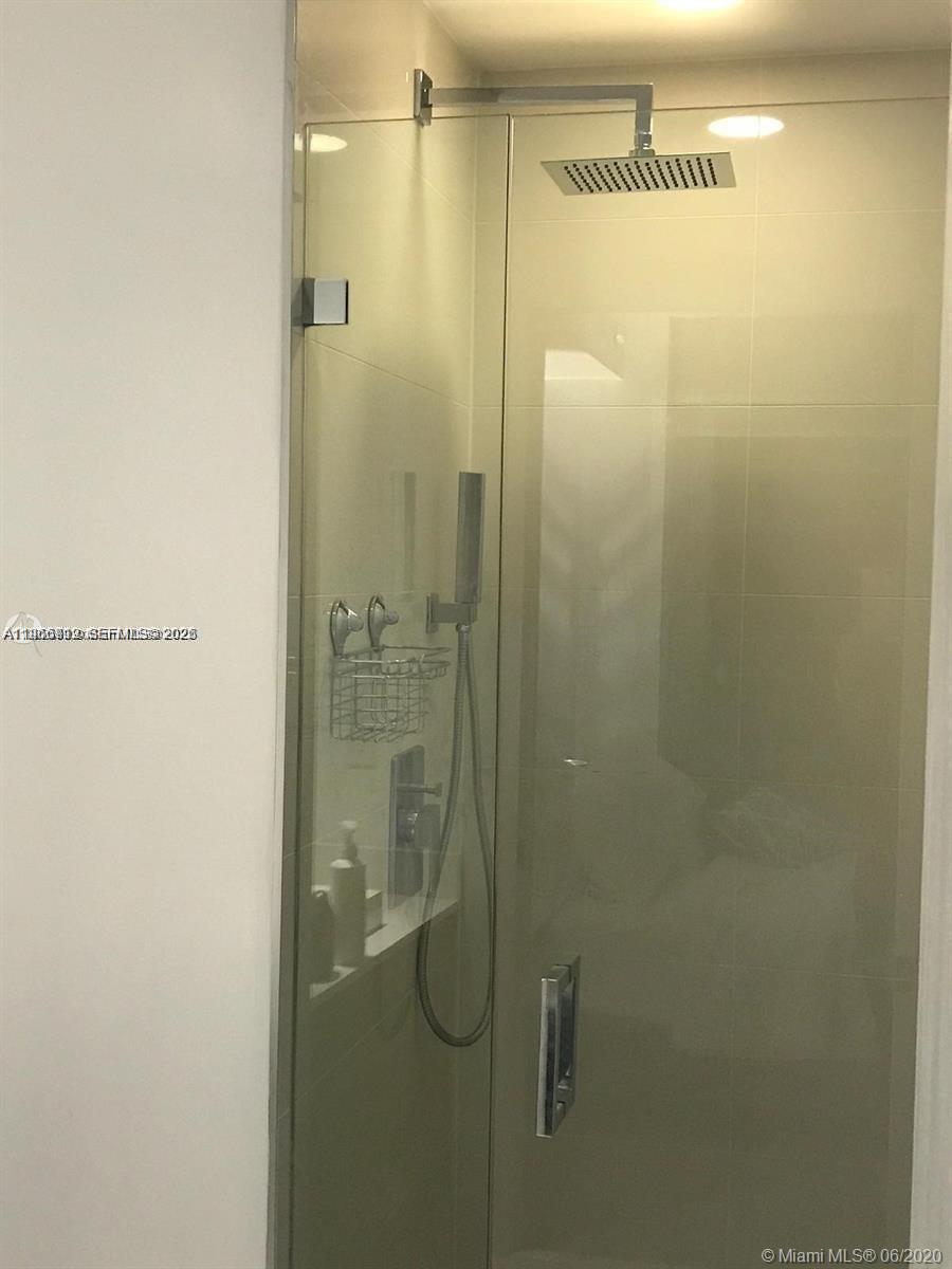 55 Southwest 9th Street, Unit 2307 Miami, FL 33130 - Photo 16 of 35 a bathroom with a shower