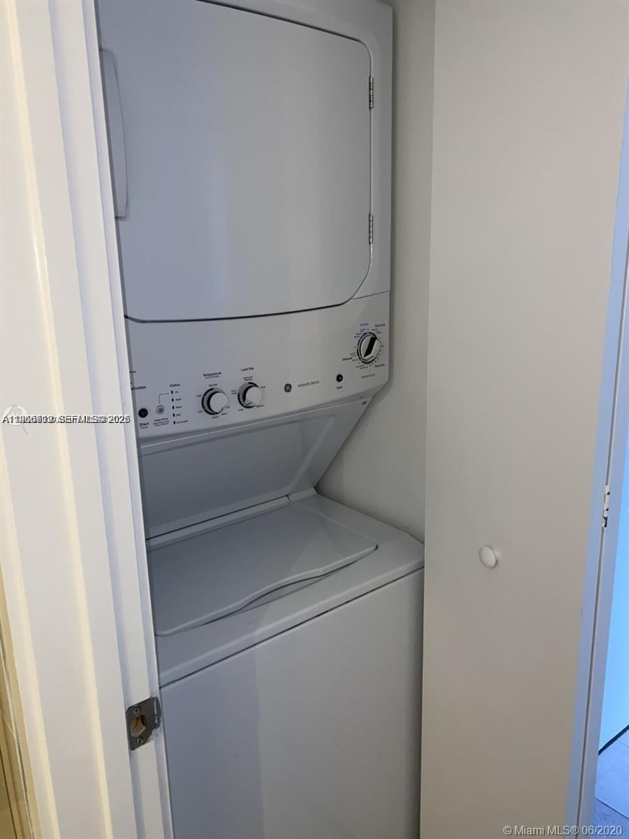 55 Southwest 9th Street, Unit 2307 Miami, FL 33130 - Photo 17 of 35 a close up view of a washer and dryer