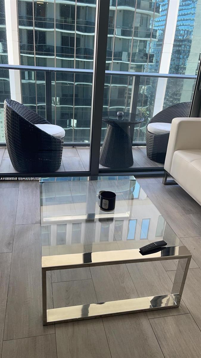 55 Southwest 9th Street, Unit 2307 Miami, FL 33130 - Photo 24 of 35 a living room with furniture and a potted plant