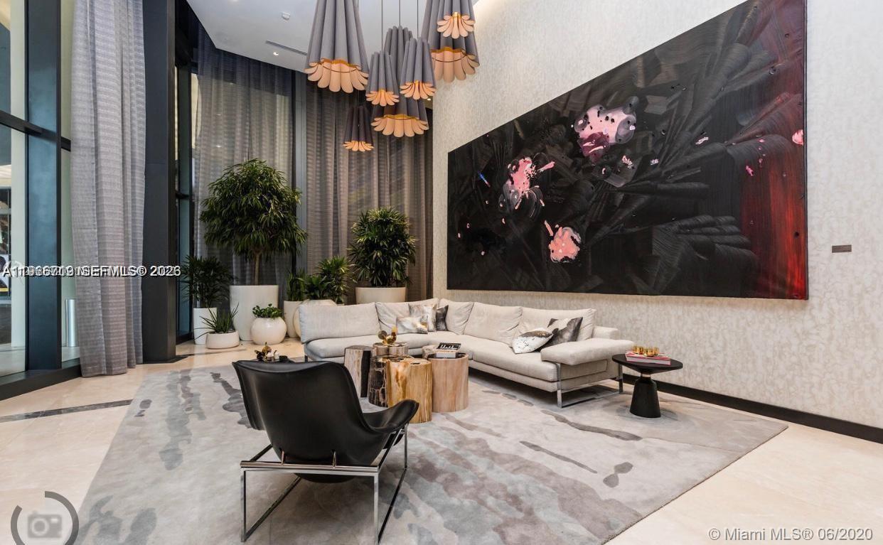 55 Southwest 9th Street, Unit 2307 Miami, FL 33130 - Photo 3 of 35 a view of a chairs and tables in patio