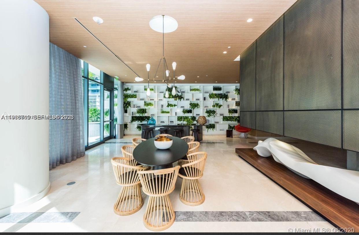 55 Southwest 9th Street, Unit 2307 Miami, FL 33130 - Photo 35 of 35 a kitchen with a dining table and chairs