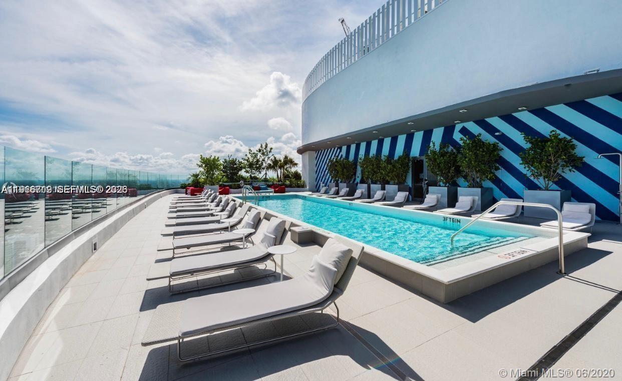 55 Southwest 9th Street, Unit 2307 Miami, FL 33130 - Photo 5 of 35 a view of a chairs and tables in the balcony