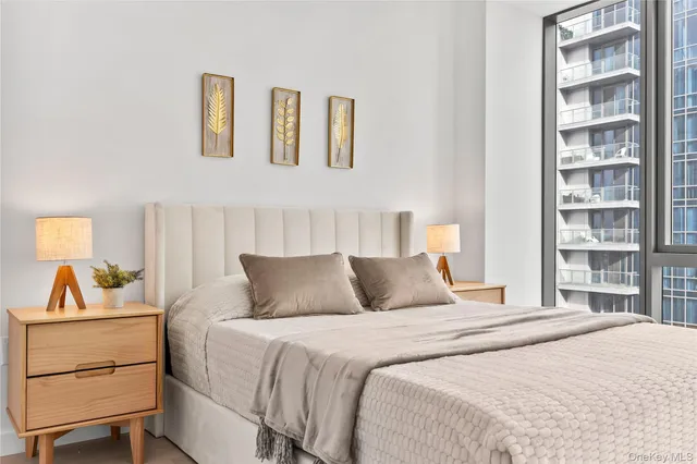 a bedroom with a bed and a cabinets