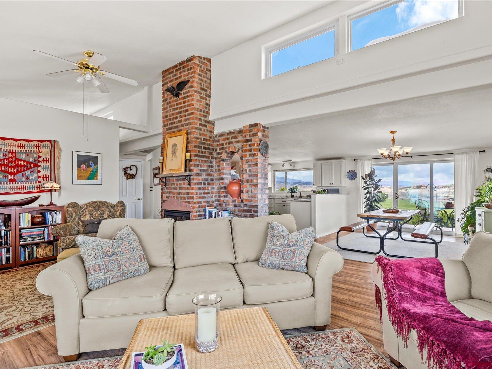 68149 Sunshine Road Montrose, CO 81401 - Photo 11 of 33 a living room with furniture and a large window