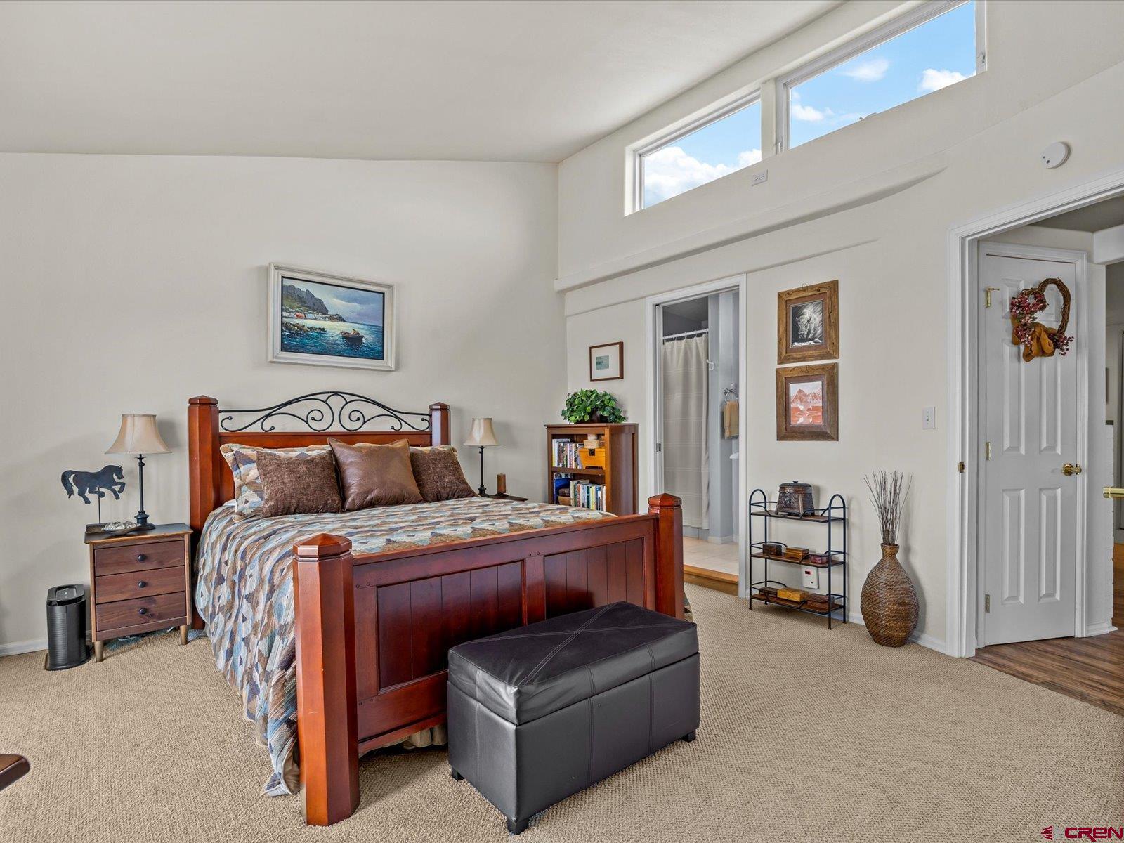 68149 Sunshine Road Montrose, CO 81401 - Photo 15 of 33 a bedroom with a bed and a couch