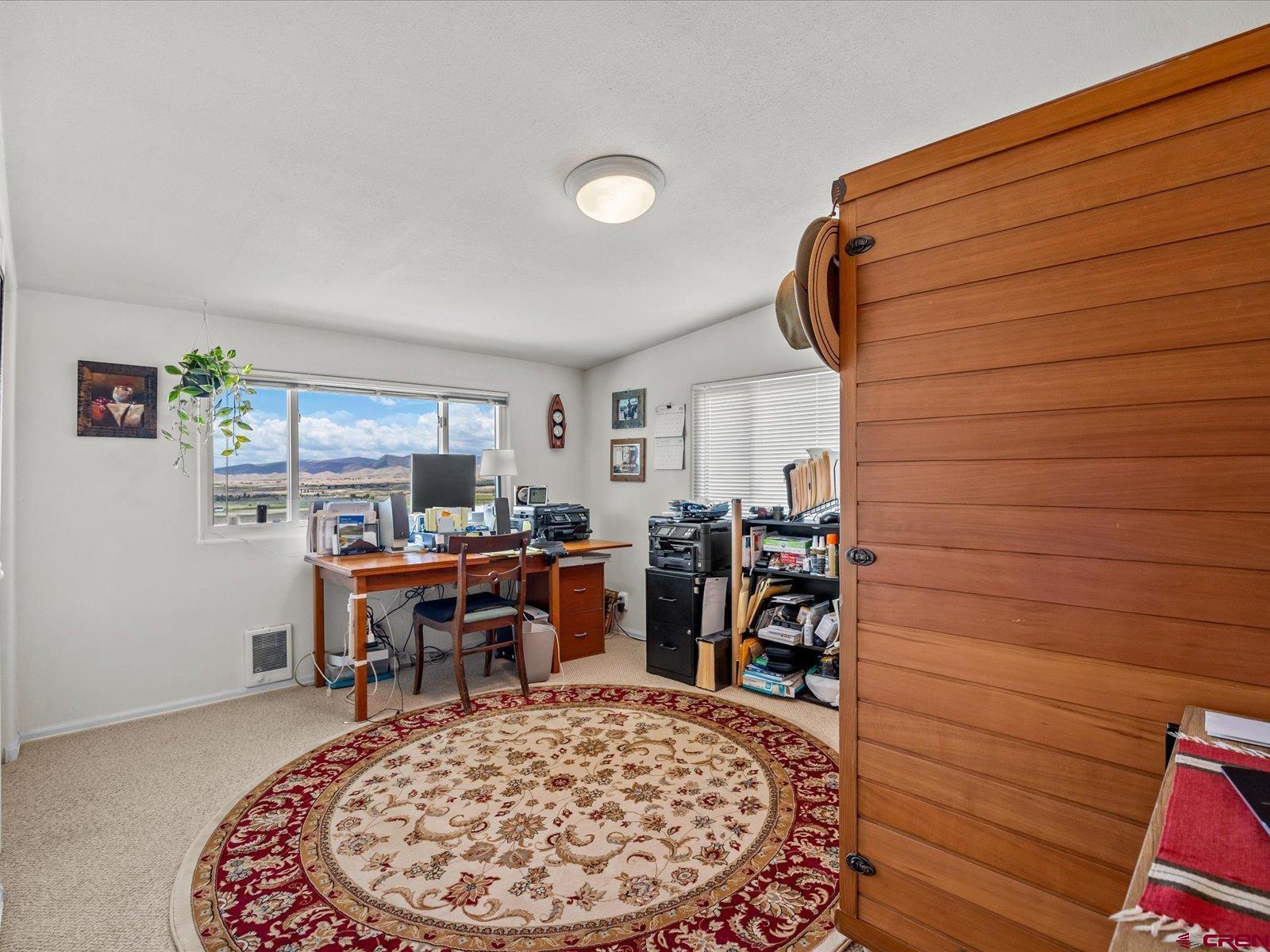 68149 Sunshine Road Montrose, CO 81401 - Photo 18 of 33 a view of a workspace with furniture