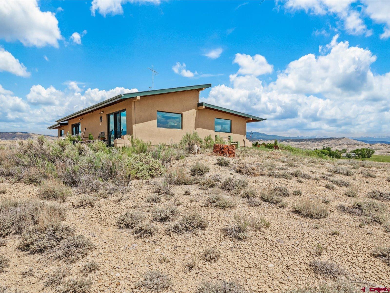 68149 Sunshine Road Montrose, CO 81401 - Photo 24 of 33 a house view with a backyard space