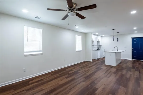 a view of kitchen with wooden floor and windows