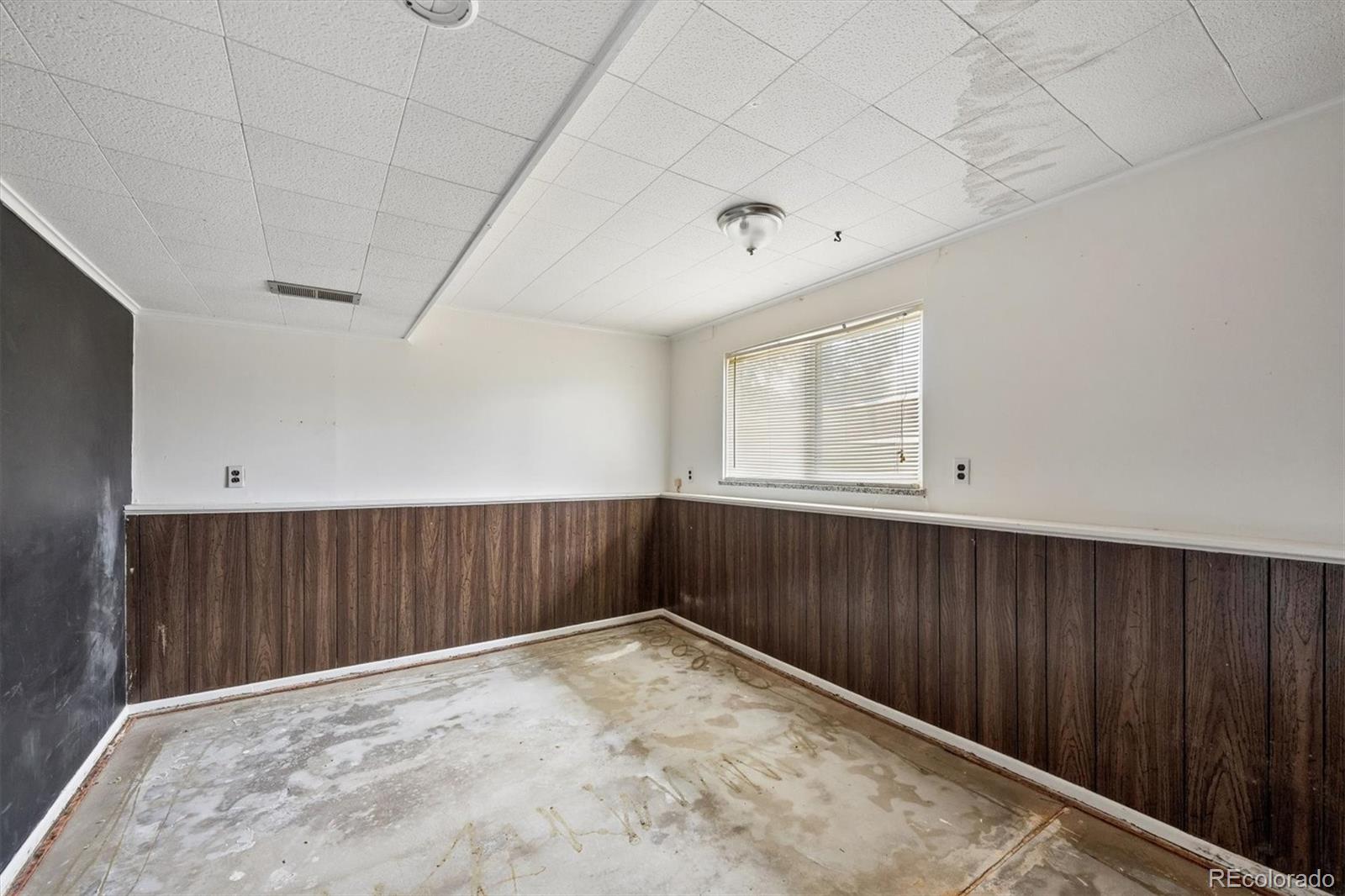 404 Neptune Court Lone Tree, CO 80124 - Photo 11 of 16 a view of an empty room with wooden floor