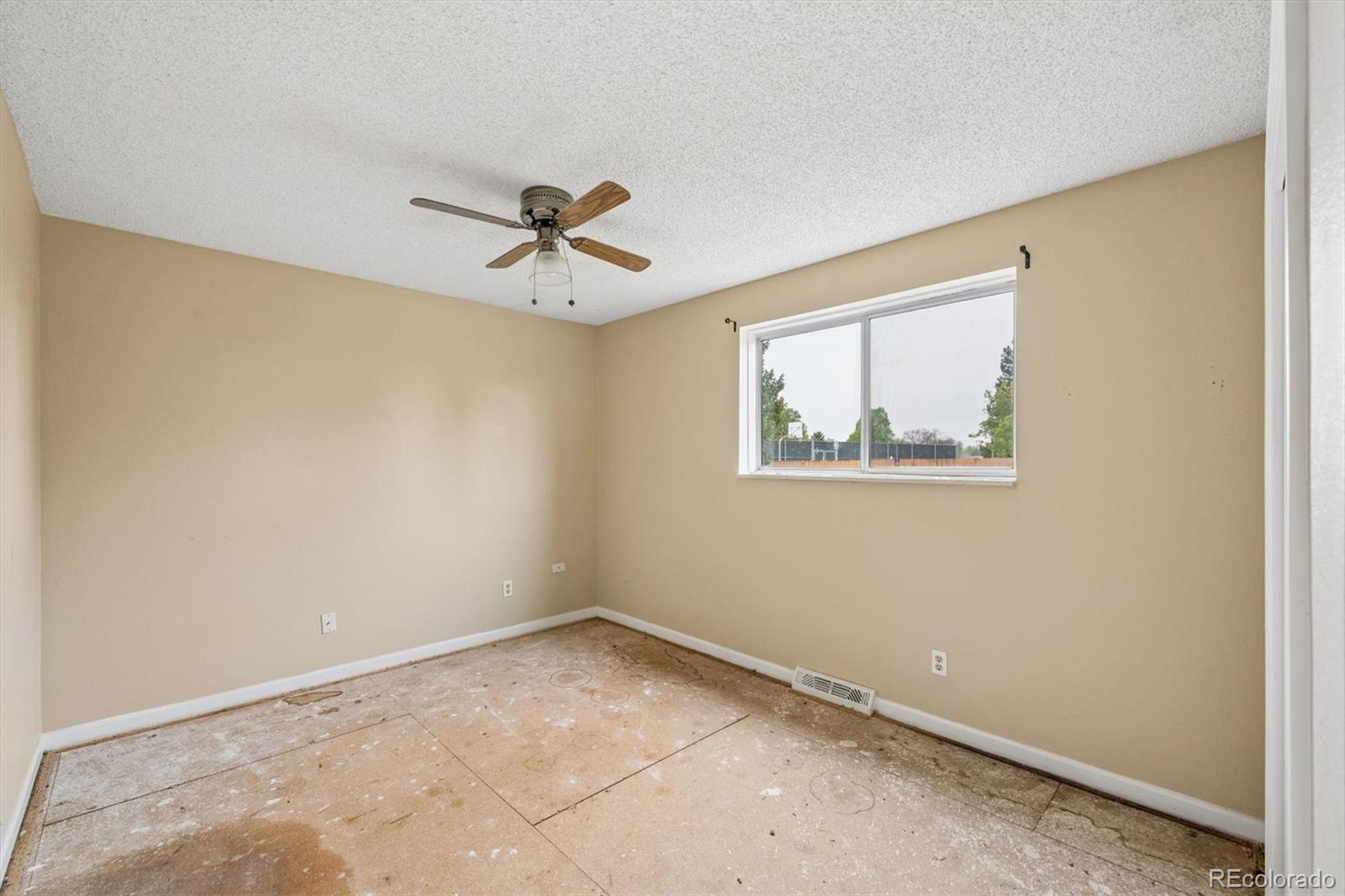 404 Neptune Court Lone Tree, CO 80124 - Photo 5 of 16 a view of an empty room with a window
