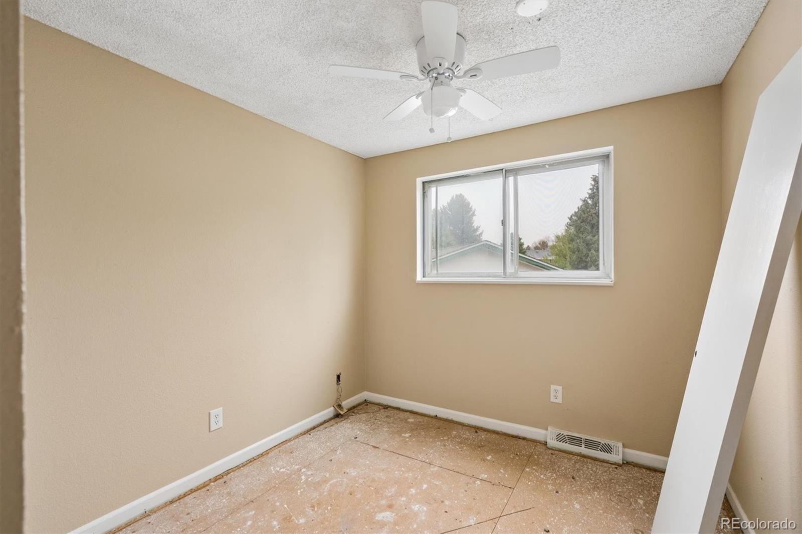404 Neptune Court Lone Tree, CO 80124 - Photo 6 of 16 a view of room with window and ceiling fan