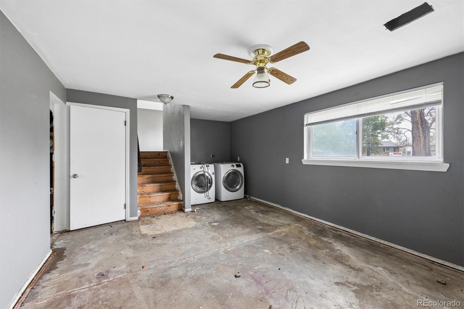 404 Neptune Court Lone Tree, CO 80124 - Photo 10 of 16 a view of a livingroom with a ceiling fan and window
