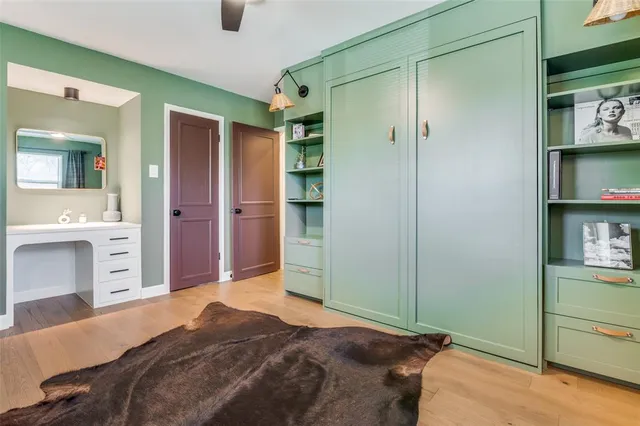 a bedroom with a bed and a dresser