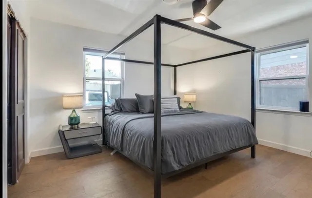 a bedroom with a bed and window