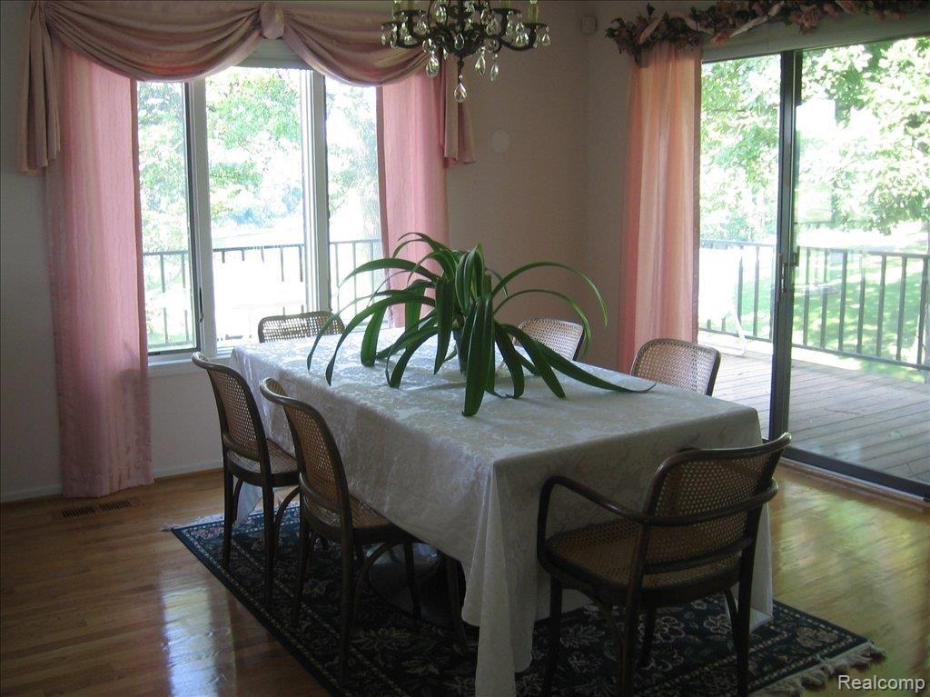 1883 Wingate Road, Unit 1 Bloomfield Hills, MI 48302 - Photo 6 of 19 Dining roon with deck access