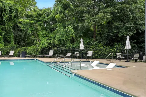 a view of a swimming pool with a patio