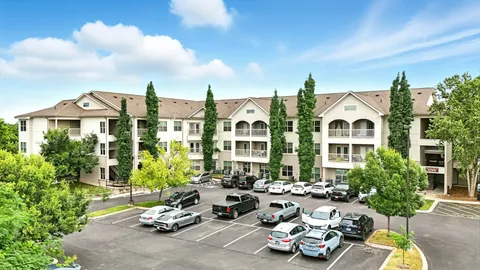 a group of cars parked in front of a building