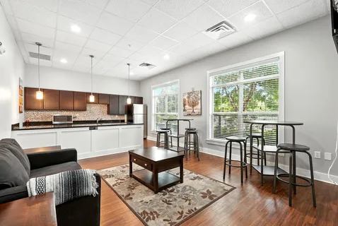 a living room with furniture and a flat screen tv
