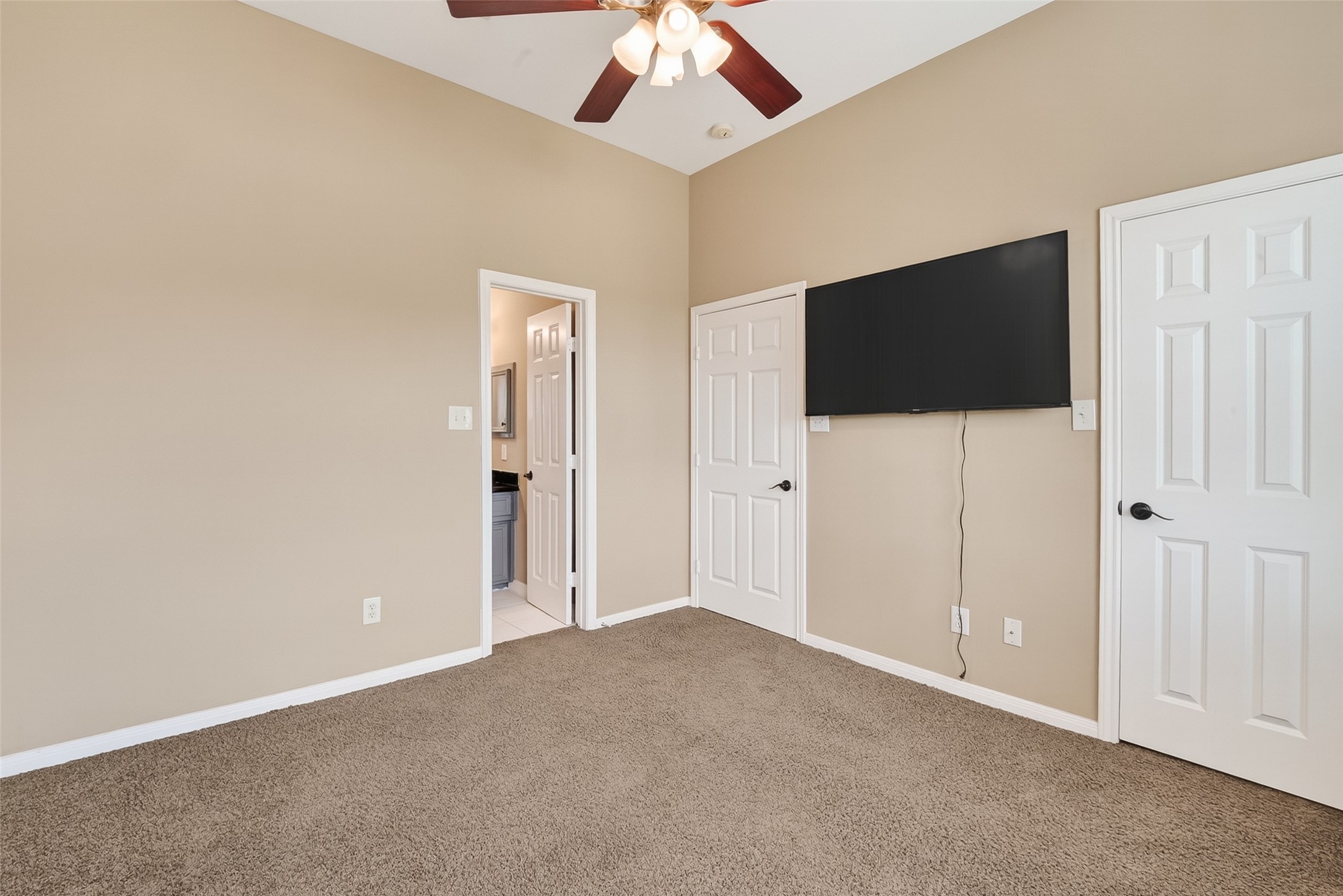 2804 Chenevert Street Houston, TX 77004 - Photo 24 of 37 an empty room with closet and a flat screen tv