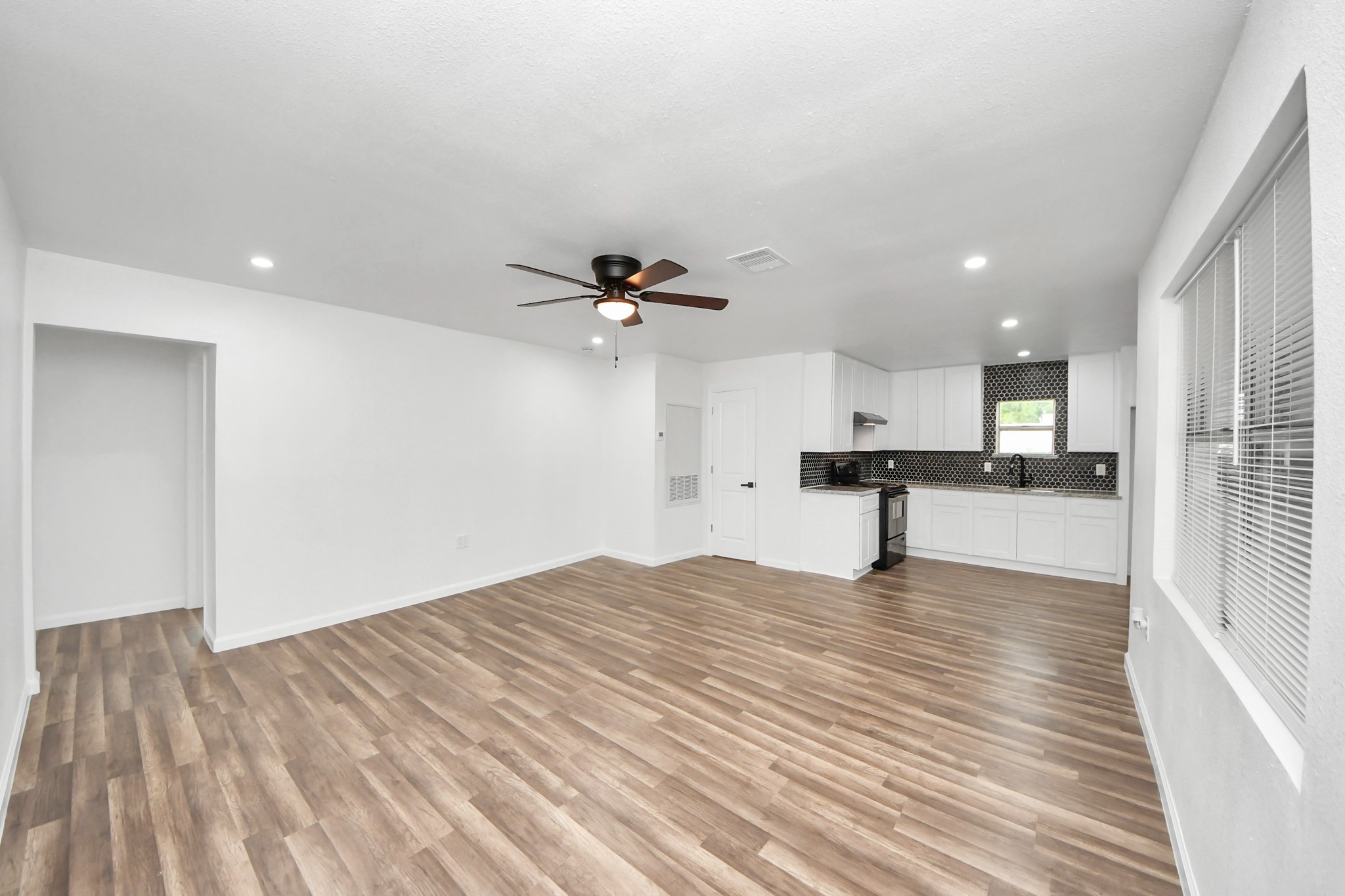 207 East Defee Avenue Baytown, TX 77520 - Photo 9 of 36 a view of empty room with wooden floor