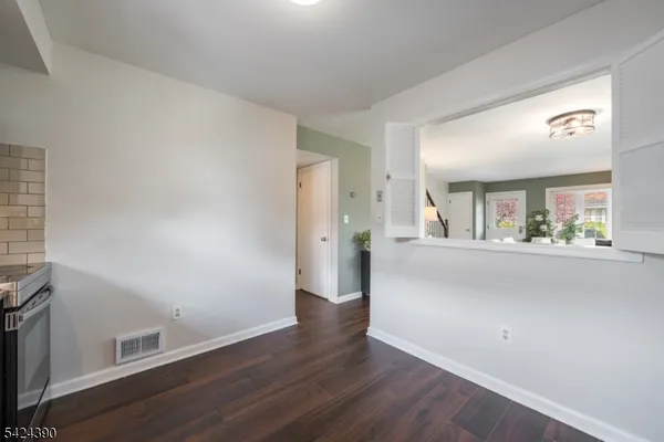 a view of a hallway with a hardwood floor