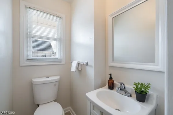 a bedroom with a bed and a mirror