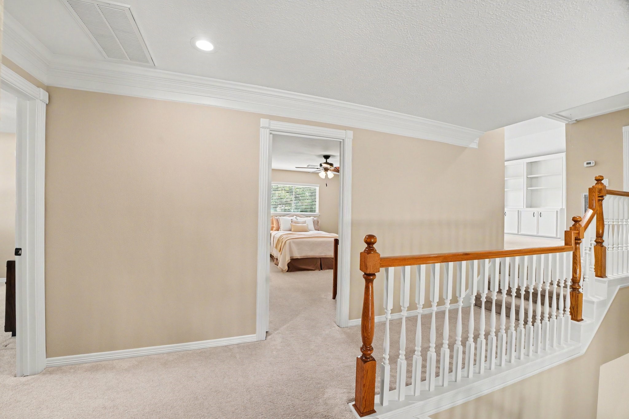 3411 Fir Forest Drive Spring, TX 77388 - Photo 25 of 39 The hallway at the top of the stairs connects the three secondary bedrooms and game room.