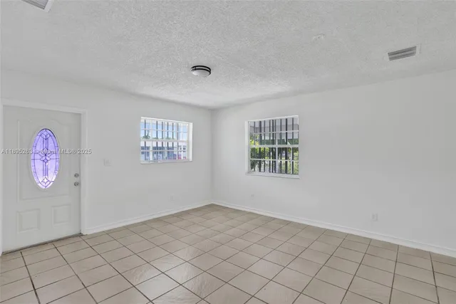 a view of an empty room and window