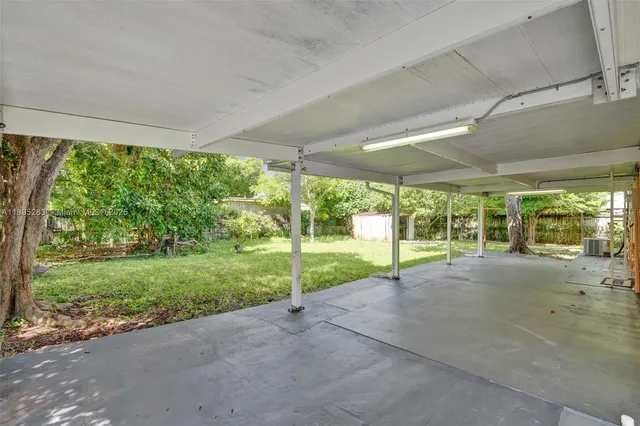 a view of a yard with porch and garden