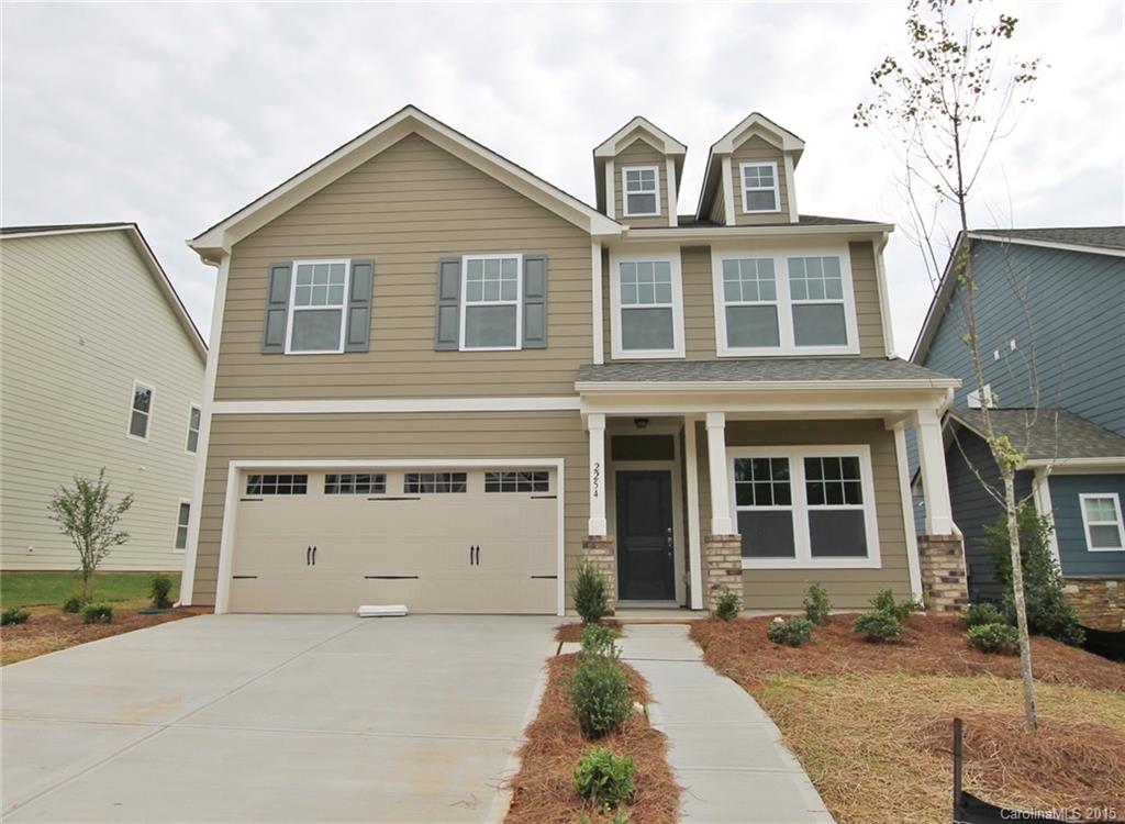 2254 Bluebell Way, Unit 156 Fort Mill, SC 29708 - Photo 1 of 23 a view of a house with a yard and large tree