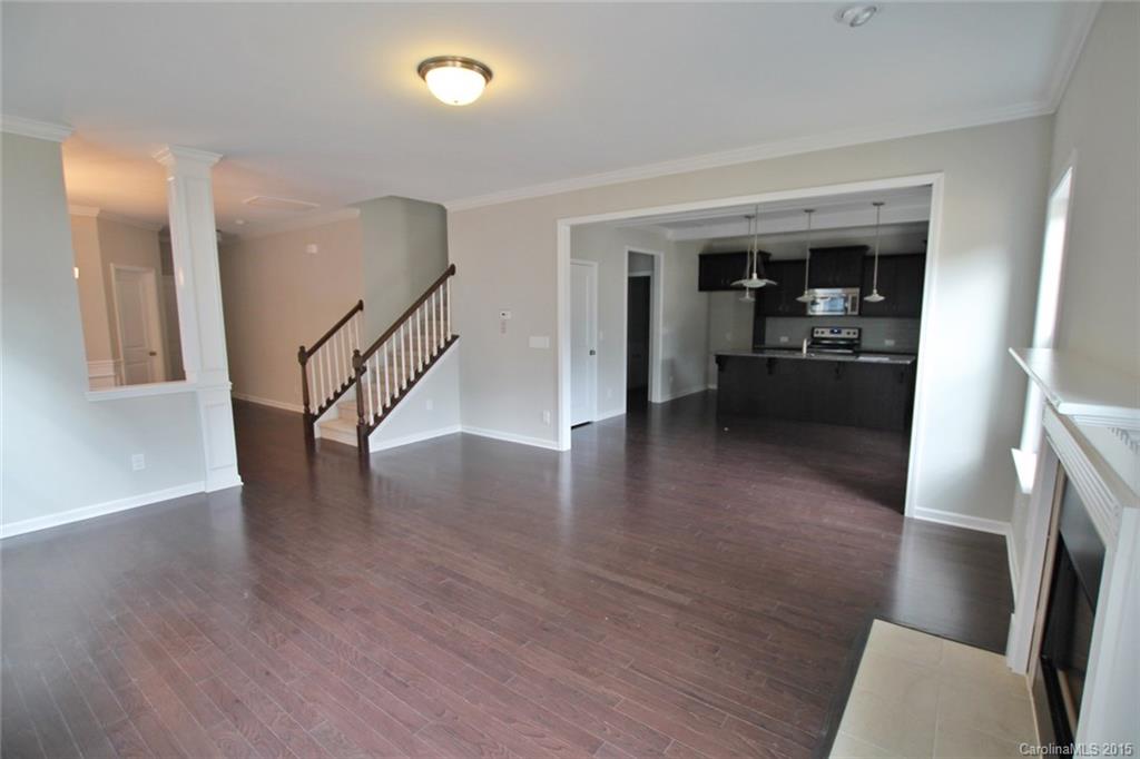 2254 Bluebell Way, Unit 156 Fort Mill, SC 29708 - Photo 4 of 23 a view of a livingroom with wooden floor and furniture