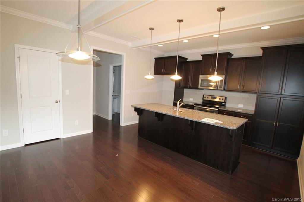 2254 Bluebell Way, Unit 156 Fort Mill, SC 29708 - Photo 9 of 23 a kitchen with stainless steel appliances granite countertop a refrigerator a sink and a stove
