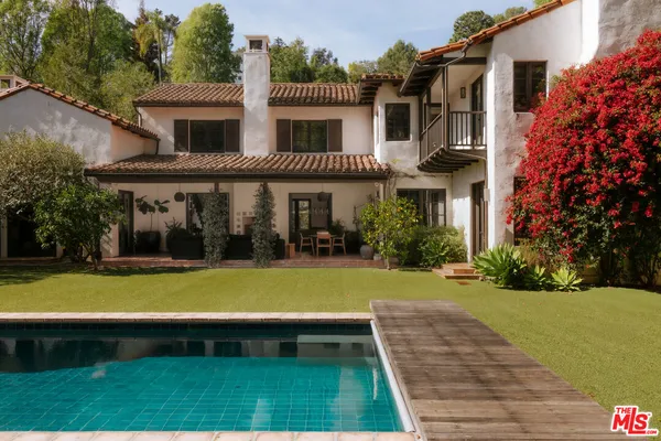 a view of a house with a swimming pool