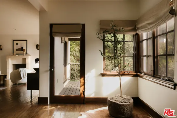 a bathroom with a double vanity sink a mirror and a bathtub
