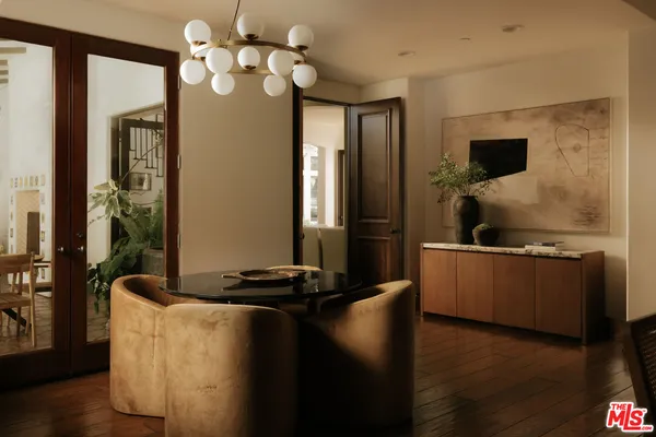 a kitchen with a table and chairs in it