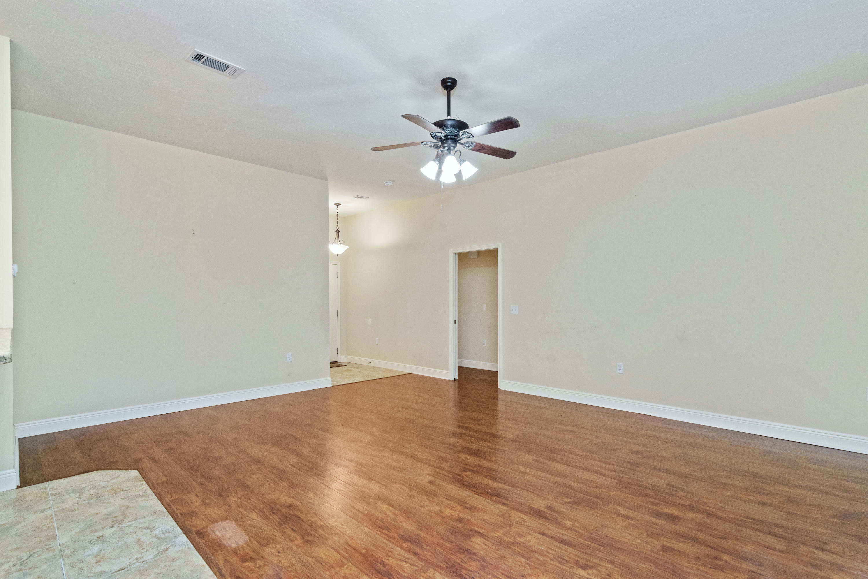112 Pointer Lane Crestview, FL 32536 - Photo 5 of 28 entryway into living/door to hallway